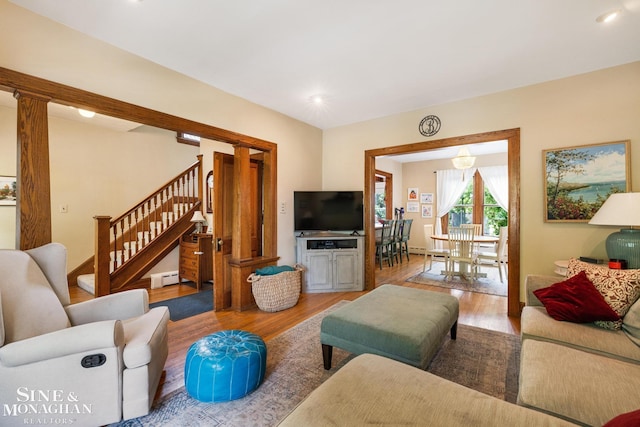 1117 Lakepointe St, Grosse Pointe Park, MI 48230 - living area with wood finished floors, stairway, a baseboard radiator, and recessed lighting