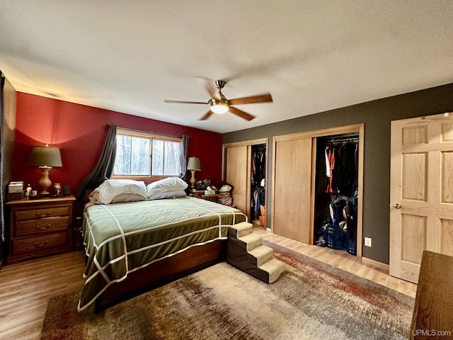 39 Stonegate Hts, Marquette, MI 49855 - bedroom featuring wood finished floors, multiple closets, and a ceiling fan