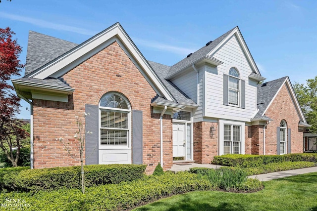 683 Morningside Ln, Grosse Pointe Woods, MI 48236 - view of front of house with brick siding and a shingled roof