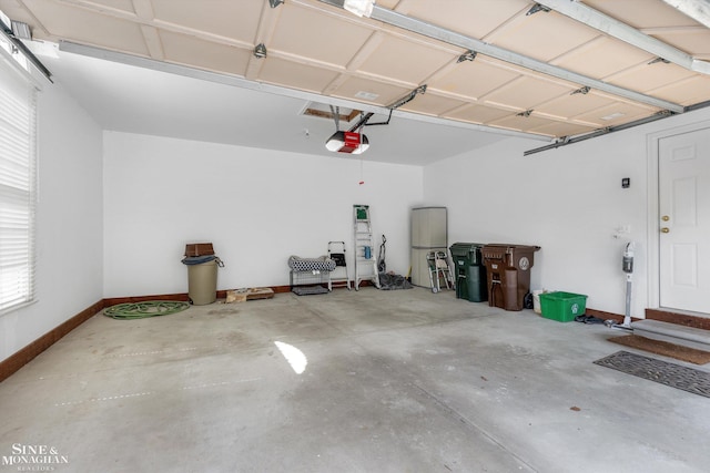 683 Morningside Ln, Grosse Pointe Woods, MI 48236 - garage featuring a garage door opener and baseboards