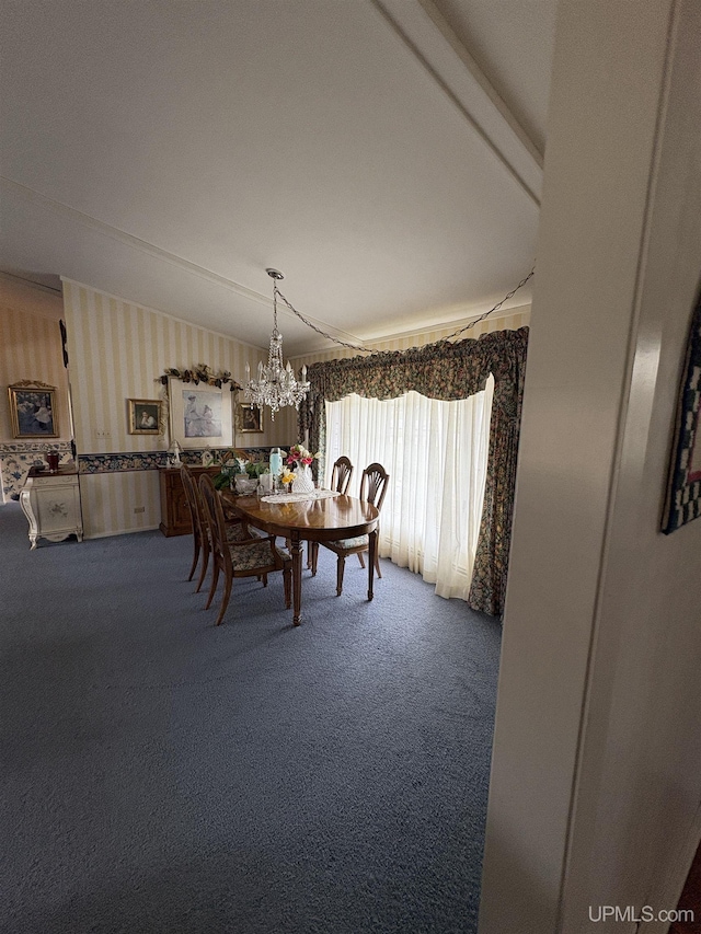 303 Jonathon Carver Rd, Marquette, MI 49855 - carpeted dining space with wallpapered walls and a chandelier