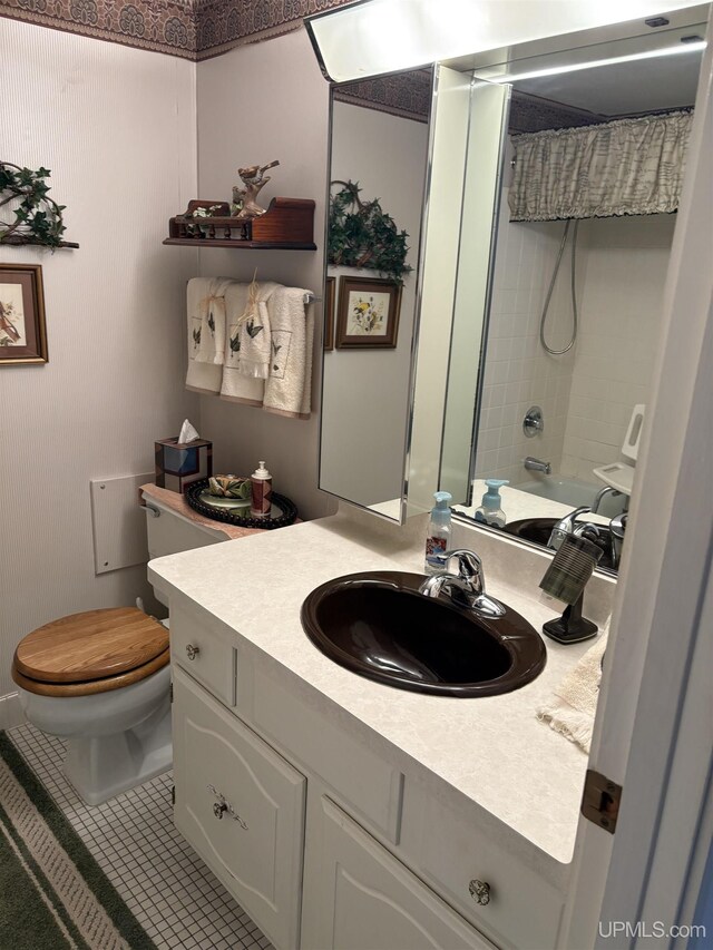 303 Jonathon Carver Rd, Marquette, MI 49855 - full bath with toilet, vanity, and tile patterned flooring