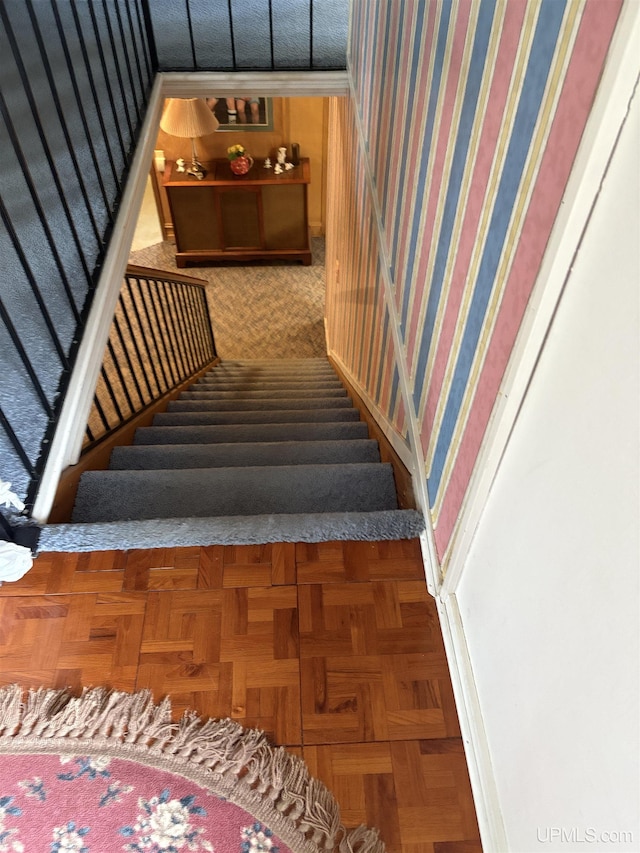 303 Jonathon Carver Rd, Marquette, MI 49855 - stairway with wallpapered walls and baseboards
