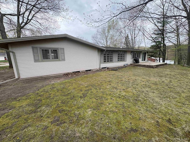 303 Jonathon Carver Rd, Marquette, MI 49855 - rear view of property with a lawn and a deck