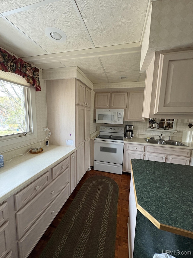 303 Jonathon Carver Rd, Marquette, MI 49855 - kitchen featuring white appliances, a sink, a textured ceiling, and light countertops