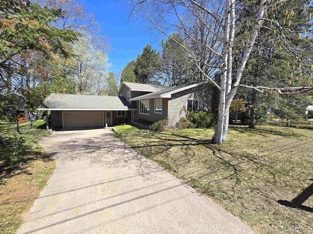 1604 Mildred Ave, Marquette, MI 49855 - view of front of house featuring an attached garage and driveway