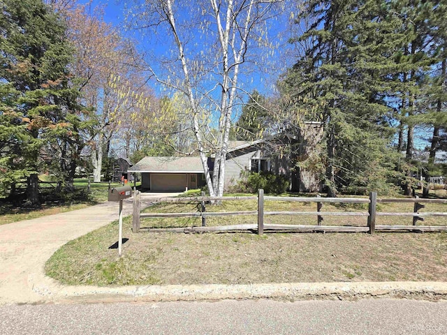 1604 Mildred Ave, Marquette, MI 49855 - view of front facade featuring concrete driveway and a garage