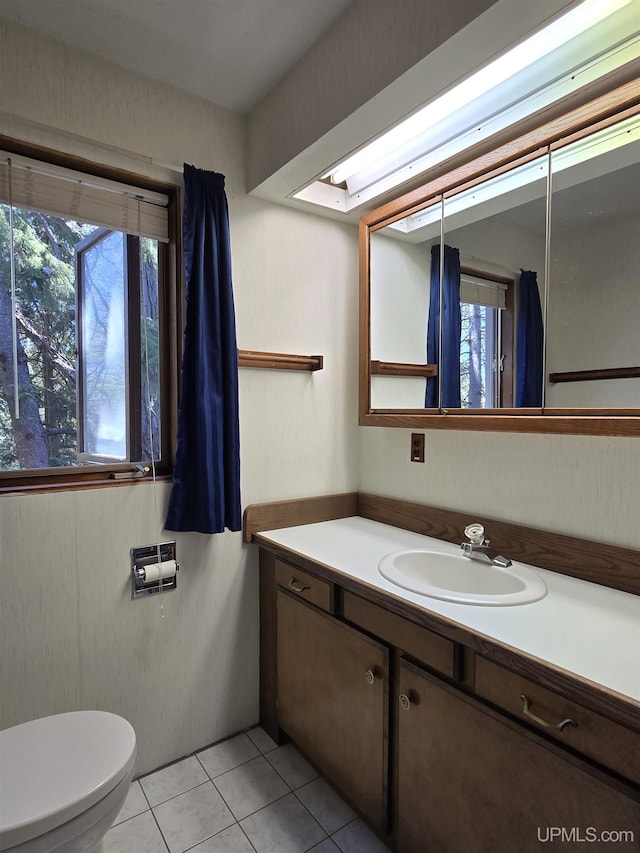 1604 Mildred Ave, Marquette, MI 49855 - half bath with healthy amount of natural light, tile patterned floors, vanity, and toilet