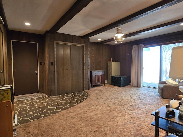 1604 Mildred Ave, Marquette, MI 49855 - living room featuring beamed ceiling, wood walls, carpet flooring, and recessed lighting