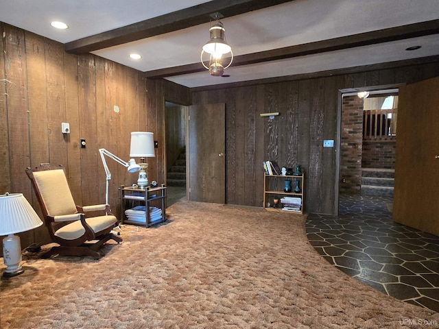 1604 Mildred Ave, Marquette, MI 49855 - sitting room with beam ceiling, wood walls, stairs, stone finish floors, and carpet