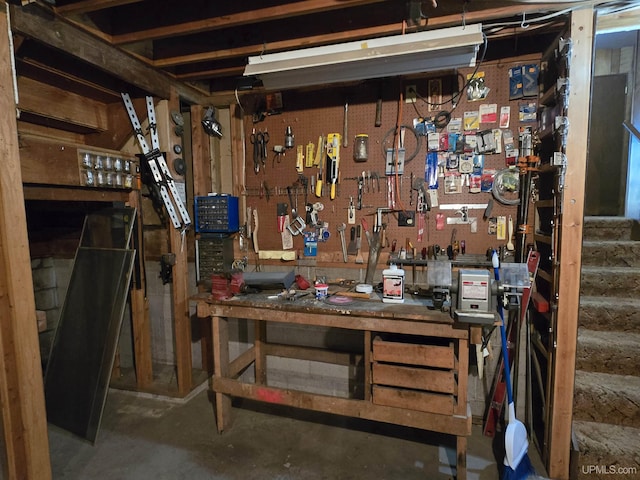 1604 Mildred Ave, Marquette, MI 49855 - below grade area featuring a workshop area and stairway
