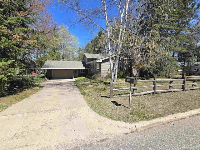 1604 Mildred Ave, Marquette, MI 49855 - tri-level home featuring fence, concrete driveway, and an attached garage