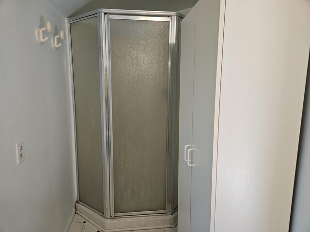 5440 Custer Dr, Harrison, MI 48625 - full bathroom featuring a stall shower, tile patterned flooring, and baseboards