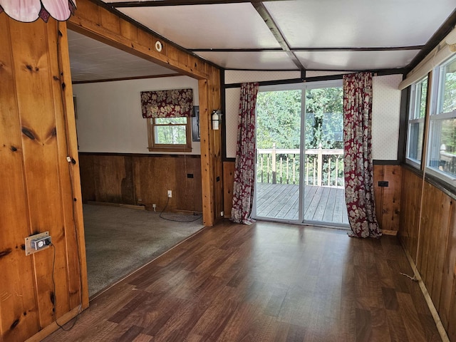 5440 Custer Dr, Harrison, MI 48625 - empty room with wood walls, wood finished floors, plenty of natural light, and a wainscoted wall