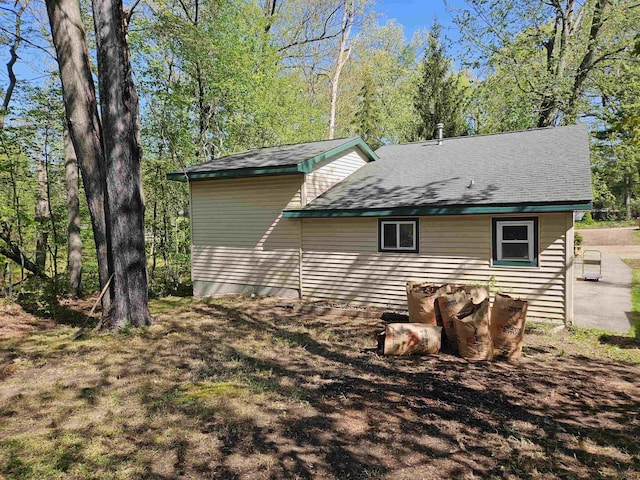 5440 Custer Dr, Harrison, MI 48625 - view of property exterior with a shingled roof