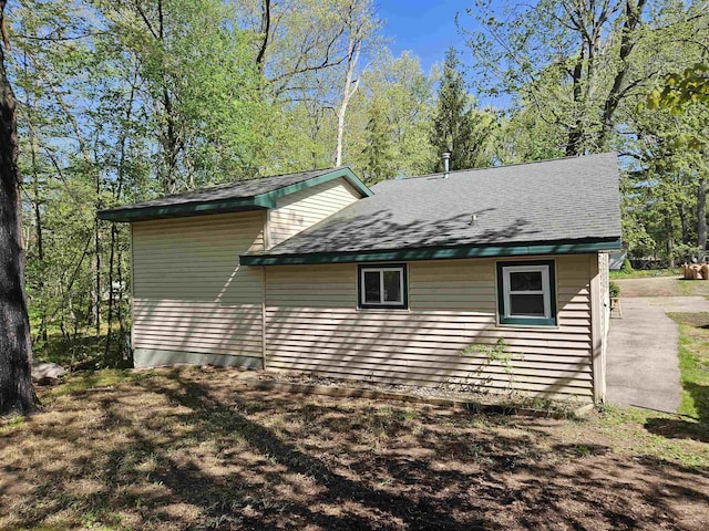 5440 Custer Dr, Harrison, MI 48625 - view of home's exterior with a shingled roof
