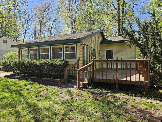 5440 Custer Dr, Harrison, MI 48625 - view of front of house featuring a deck
