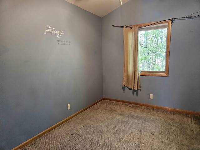 5440 Custer Dr, Harrison, MI 48625 - carpeted spare room with vaulted ceiling and baseboards