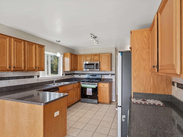 55374 Raspberry Dr, Macomb Twp, MI 48042 - kitchen featuring appliances with stainless steel finishes, light tile patterned flooring, decorative backsplash, and a sink