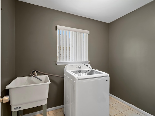 55374 Raspberry Dr, Macomb Twp, MI 48042 - laundry area featuring washer / clothes dryer, light tile patterned floors, and baseboards