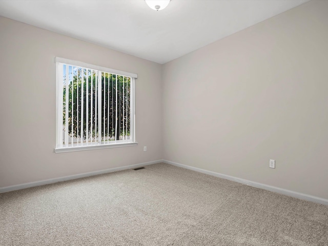 55374 Raspberry Dr, Macomb Twp, MI 48042 - empty room with carpet floors and baseboards
