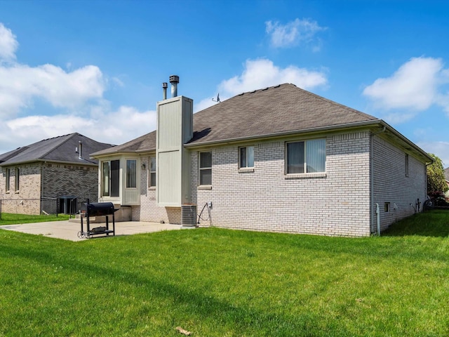55374 Raspberry Dr, Macomb Twp, MI 48042 - back of property with brick siding, a chimney, a patio area, a lawn, and central air condition unit