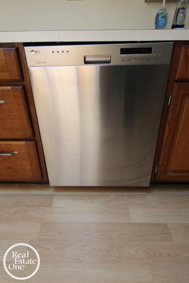 kitchen view of dishwasher and brown cabinets