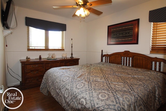 bedroom with dark wood-style flooring and a ceiling fan