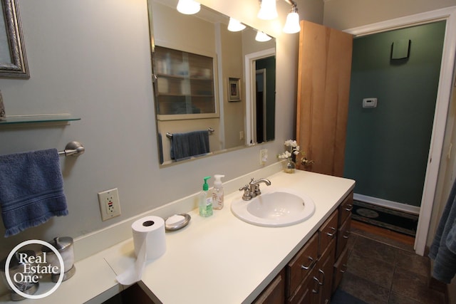 bathroom with tile patterned floors and vanity