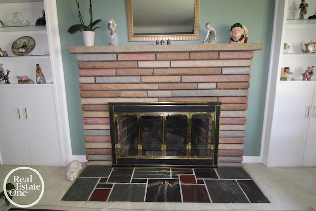 detailed view of a fireplace and carpet