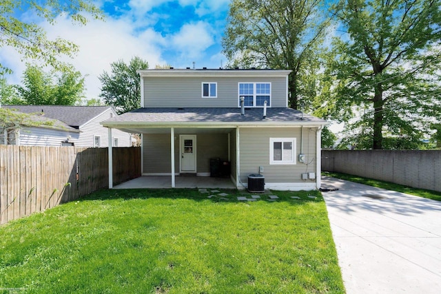rear view of property featuring a patio and cooling unit