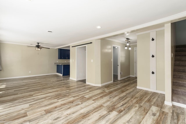 unfurnished living room featuring light wood-style flooring, a ceiling fan, crown molding, stairway, and baseboards
