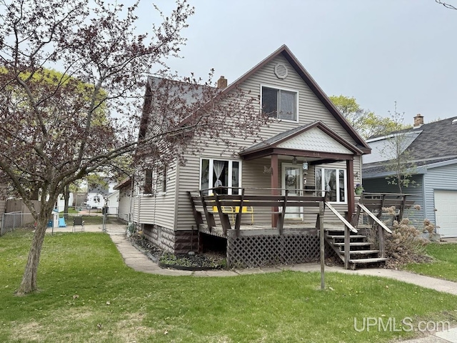 624 S 16th St, Escanaba, MI 49829 - view of front of home with a deck and a chimney