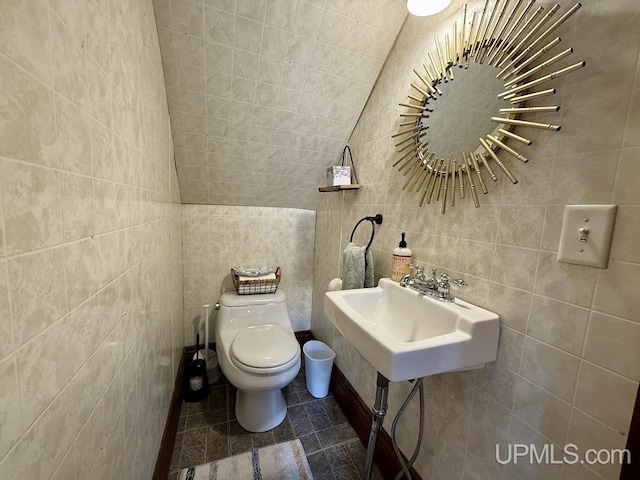 624 S 16th St, Escanaba, MI 49829 - half bath with toilet, tile walls, and a sink