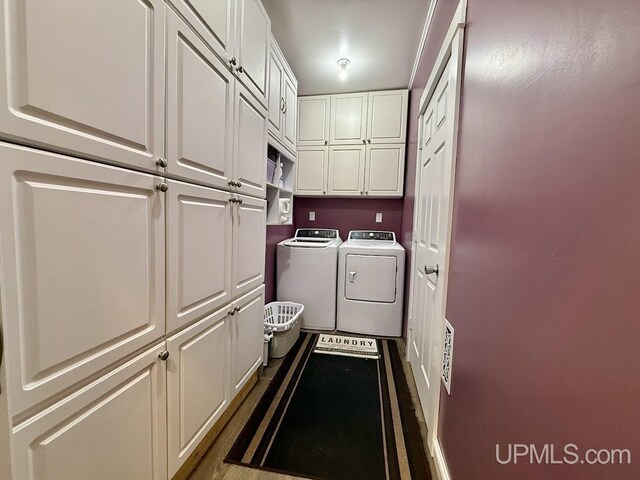 624 S 16th St, Escanaba, MI 49829 - washroom featuring cabinet space and washing machine and dryer