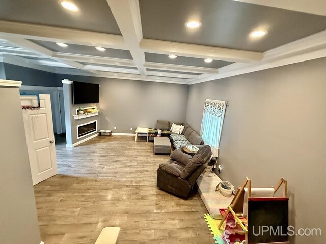624 S 16th St, Escanaba, MI 49829 - living area with recessed lighting, beam ceiling, coffered ceiling, wood finished floors, and a fireplace