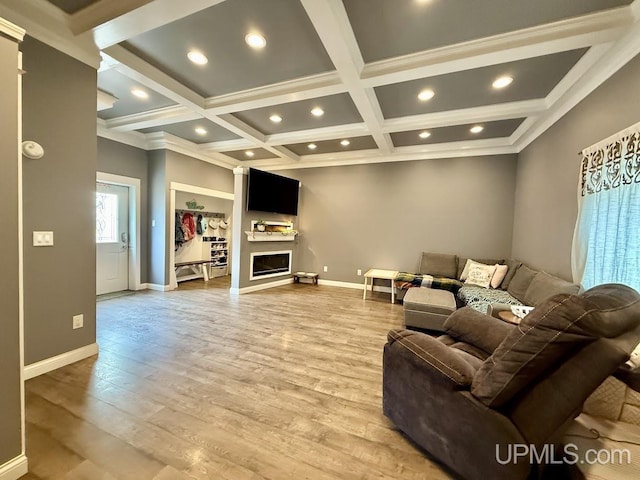 624 S 16th St, Escanaba, MI 49829 - living area with coffered ceiling, light wood-type flooring, baseboards, beam ceiling, and a fireplace