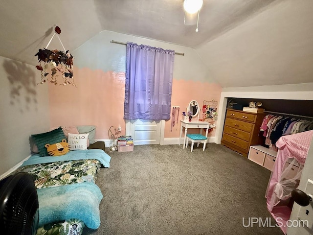 624 S 16th St, Escanaba, MI 49829 - carpeted bedroom with lofted ceiling, baseboards, and a ceiling fan
