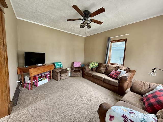 624 S 16th St, Escanaba, MI 49829 - carpeted living room featuring ceiling fan, a textured ceiling, and crown molding