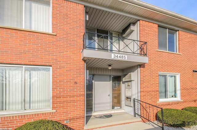 34485 Garfield Rd Apt # 1, Fraser, MI 48026 - entrance to property with a balcony and brick siding