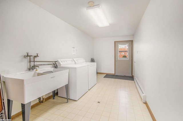 34485 Garfield Rd Apt # 1, Fraser, MI 48026 - clothes washing area with a baseboard heating unit, baseboards, and washing machine and clothes dryer