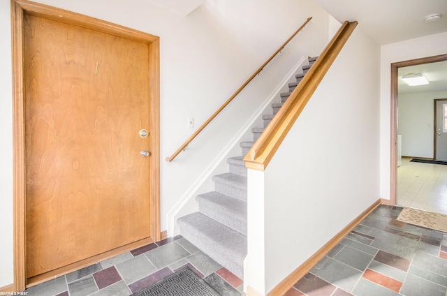 34485 Garfield Rd Apt # 1, Fraser, MI 48026 - stairway with baseboards and stone finish flooring