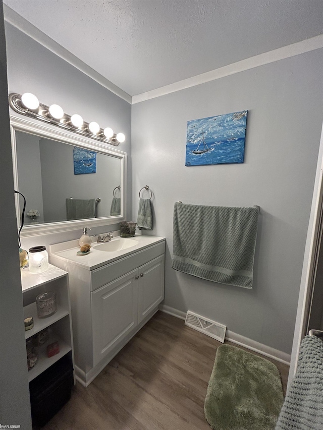 7338 Southwood St, Lexington, MI 48450 - bathroom featuring vanity, wood finished floors, and baseboards