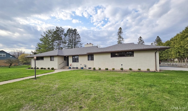 1400 W B St, Iron Mountain, MI 49801 - single story home with a front lawn, a chimney, and entry steps