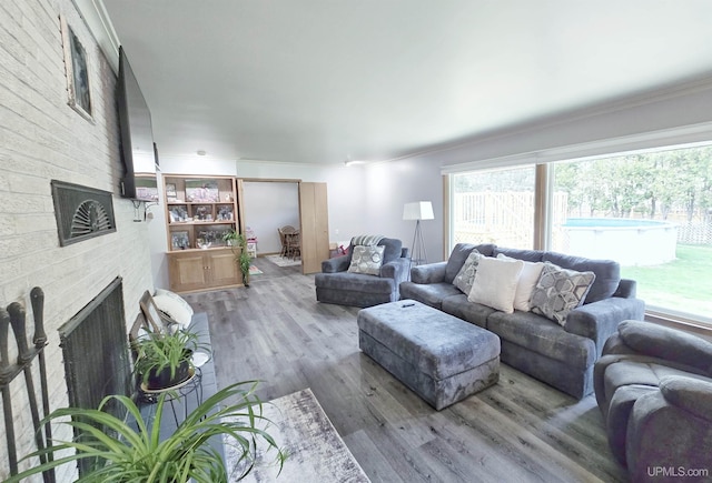 1400 W B St, Iron Mountain, MI 49801 - living room with ornamental molding, plenty of natural light, wood finished floors, and a large fireplace