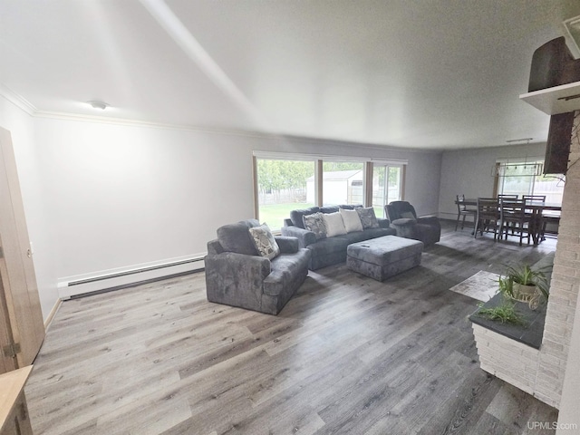1400 W B St, Iron Mountain, MI 49801 - living room featuring a baseboard radiator, crown molding, and wood finished floors