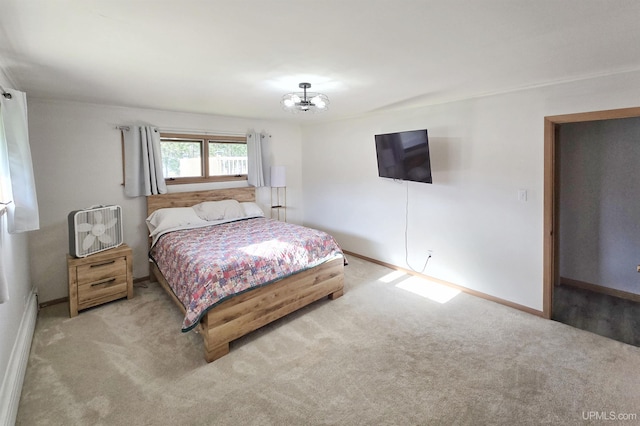 1400 W B St, Iron Mountain, MI 49801 - carpeted bedroom featuring baseboards and a chandelier