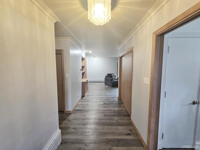 1400 W B St, Iron Mountain, MI 49801 - hallway with dark wood-style floors, crown molding, a baseboard radiator, baseboards, and a chandelier