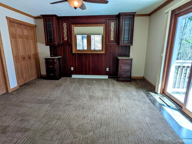 1002 Allouez Rd, Marquette, MI 49855 - unfurnished living room with a ceiling fan, crown molding, baseboards, and carpet flooring