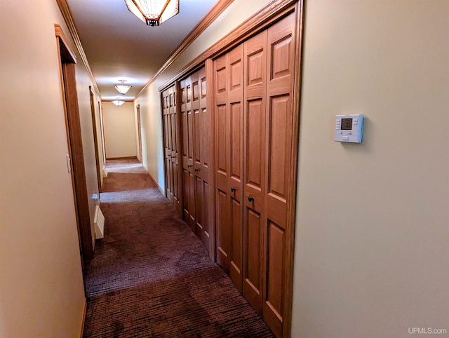 1002 Allouez Rd, Marquette, MI 49855 - hallway featuring dark carpet, crown molding, and baseboards